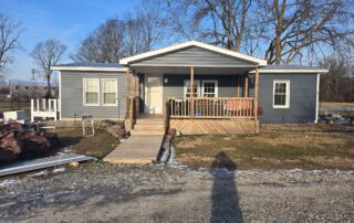 dark gray siding installation with natural wood porch and ramp by local contractor in noblesville indiana