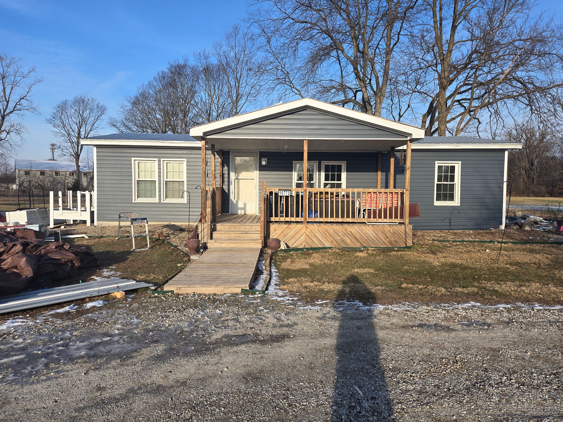 dark gray siding installation with natural wood porch and ramp by local contractor in noblesville indiana